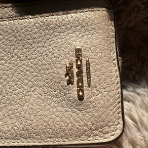 light pink coach zipper card case